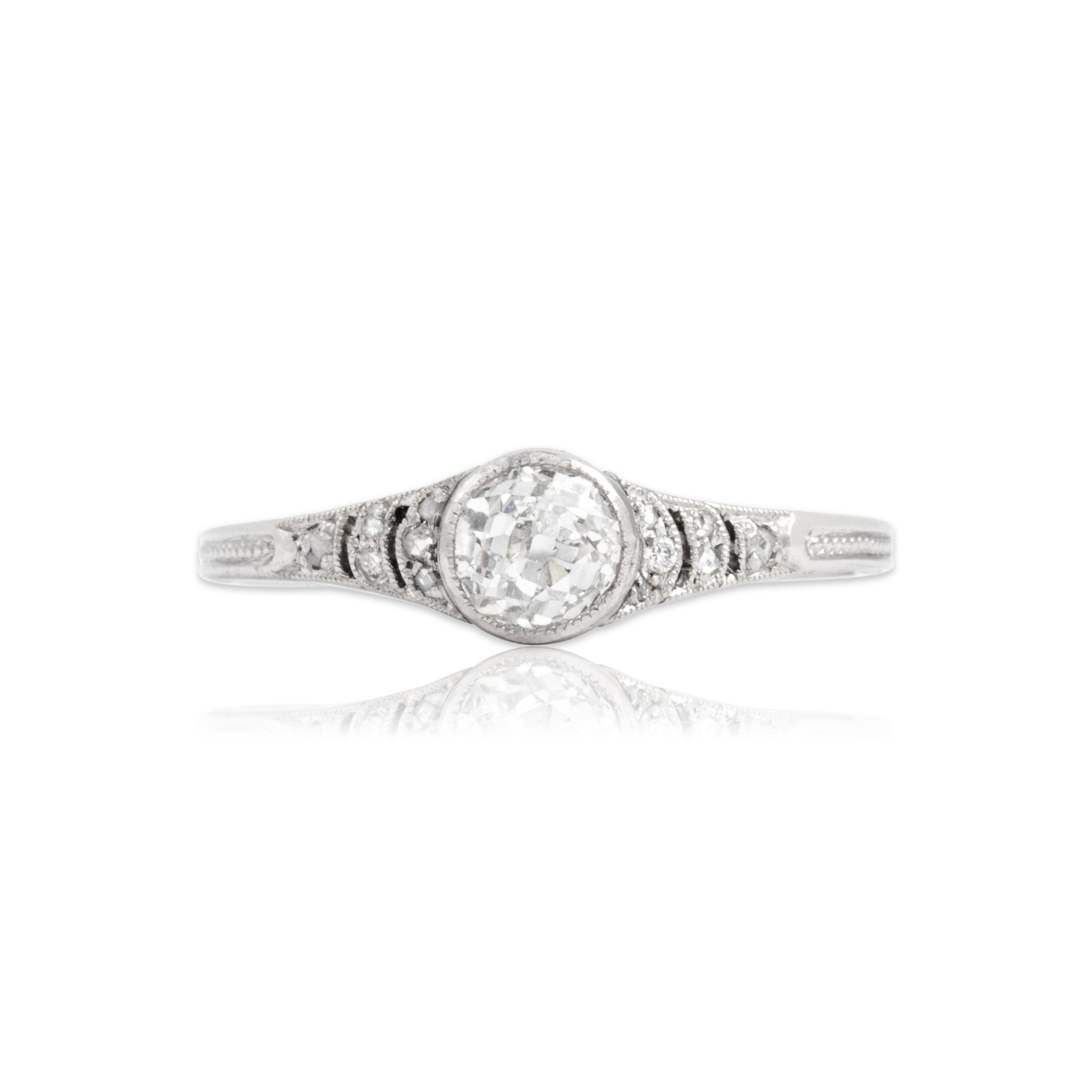 Antique Art Deco Platinum Old Mine Cut Diamond Dainty Sleek Bezel-Set Milgrain Decorated Ring - Close-up view