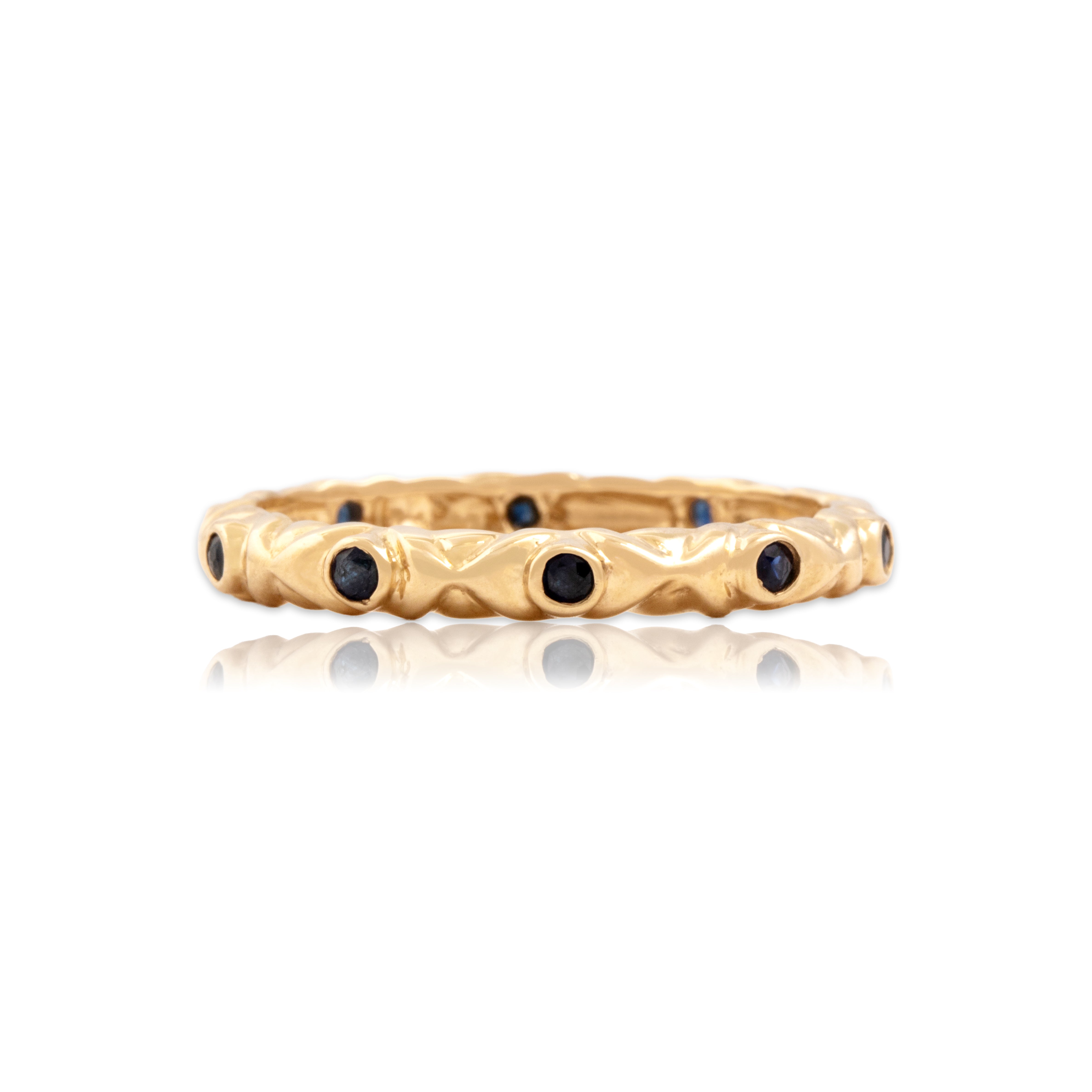 Vintage 14k Yellow Gold Blue Sapphire Knot Station Eternity Band Ring - Close-up view