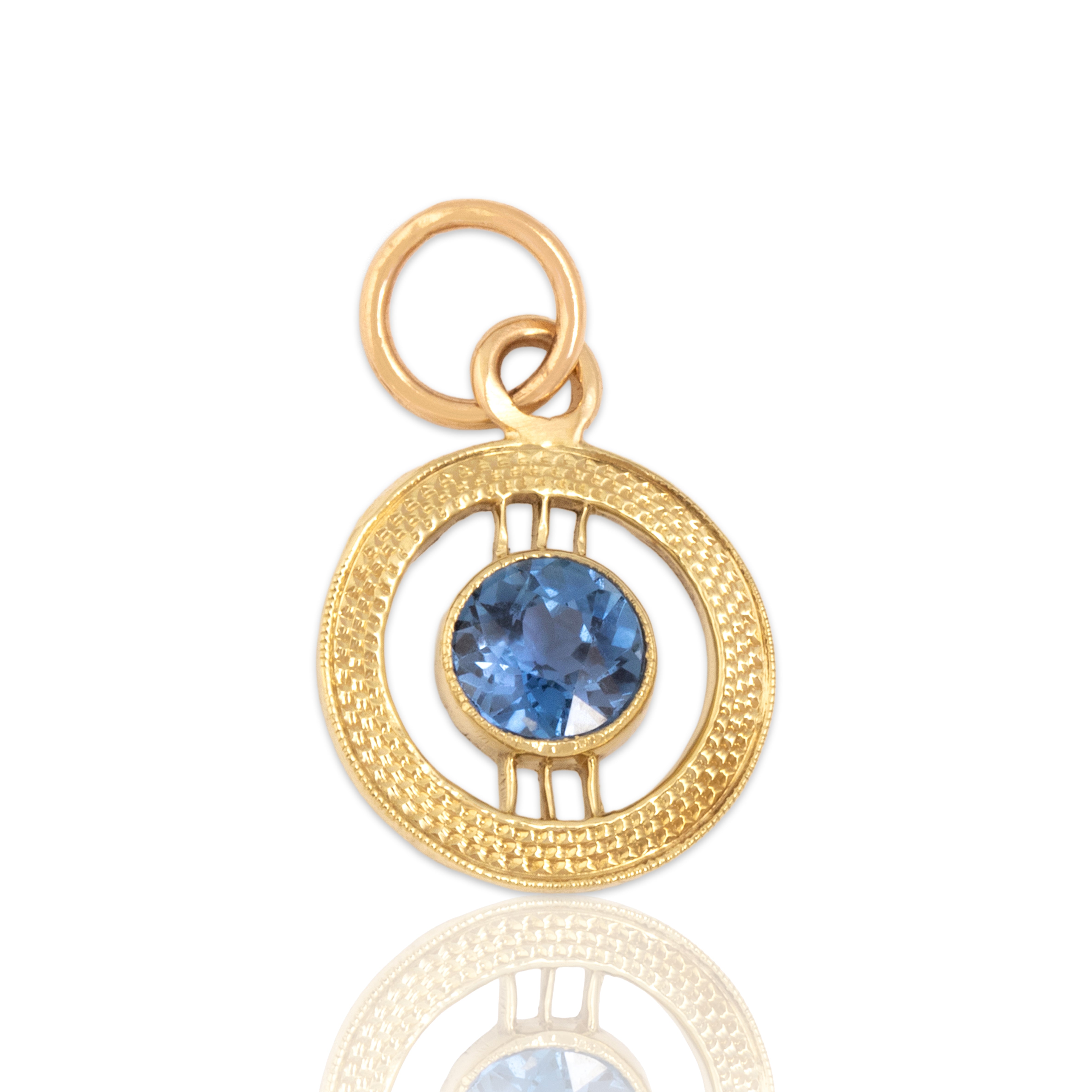 Antique Small 14k Yellow Gold Light Blue Synthetic Sapphire Textured Open Circle Charm / Pendant - Close-up view