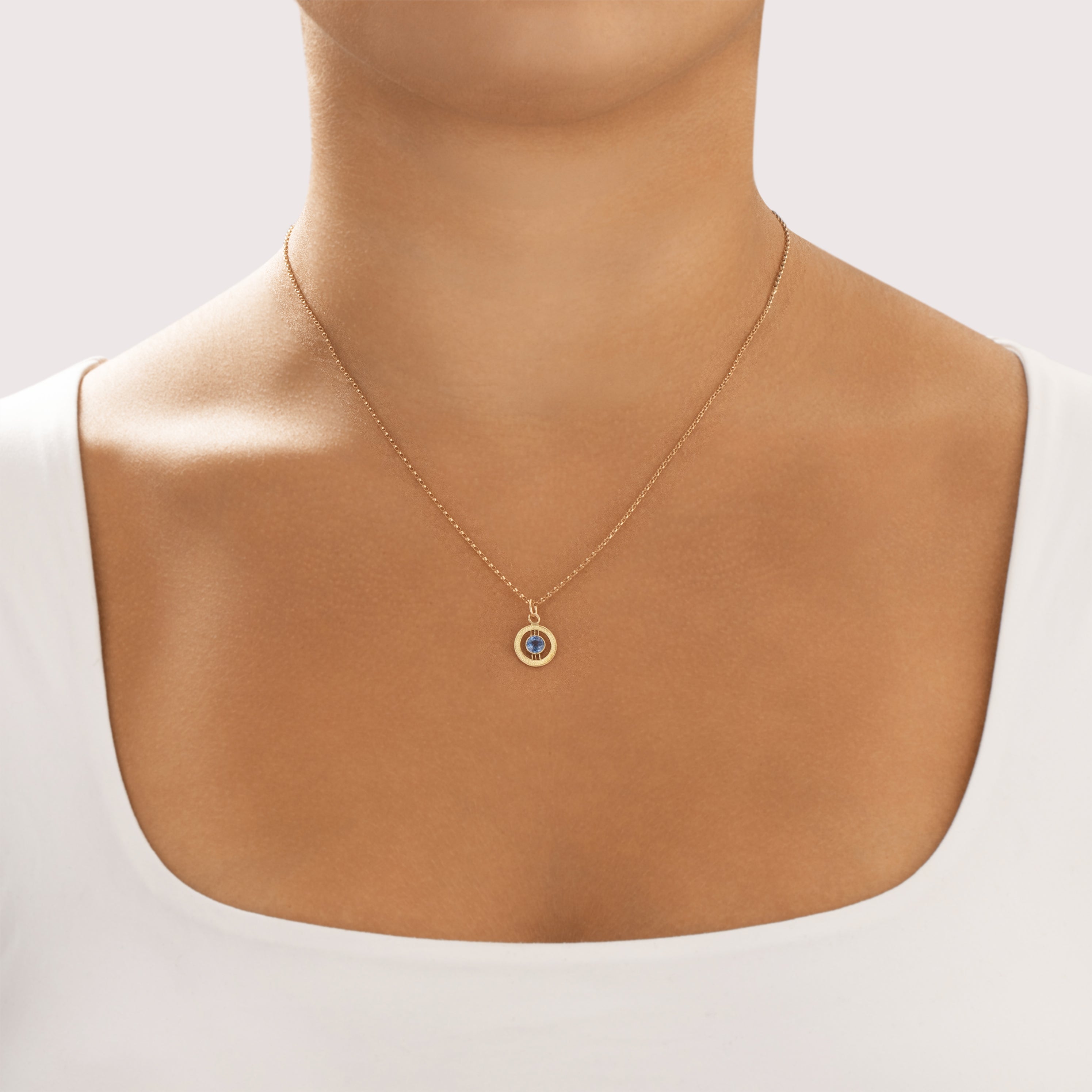 Antique Small 14k Yellow Gold Light Blue Synthetic Sapphire Textured Open Circle Charm / Pendant - On model view