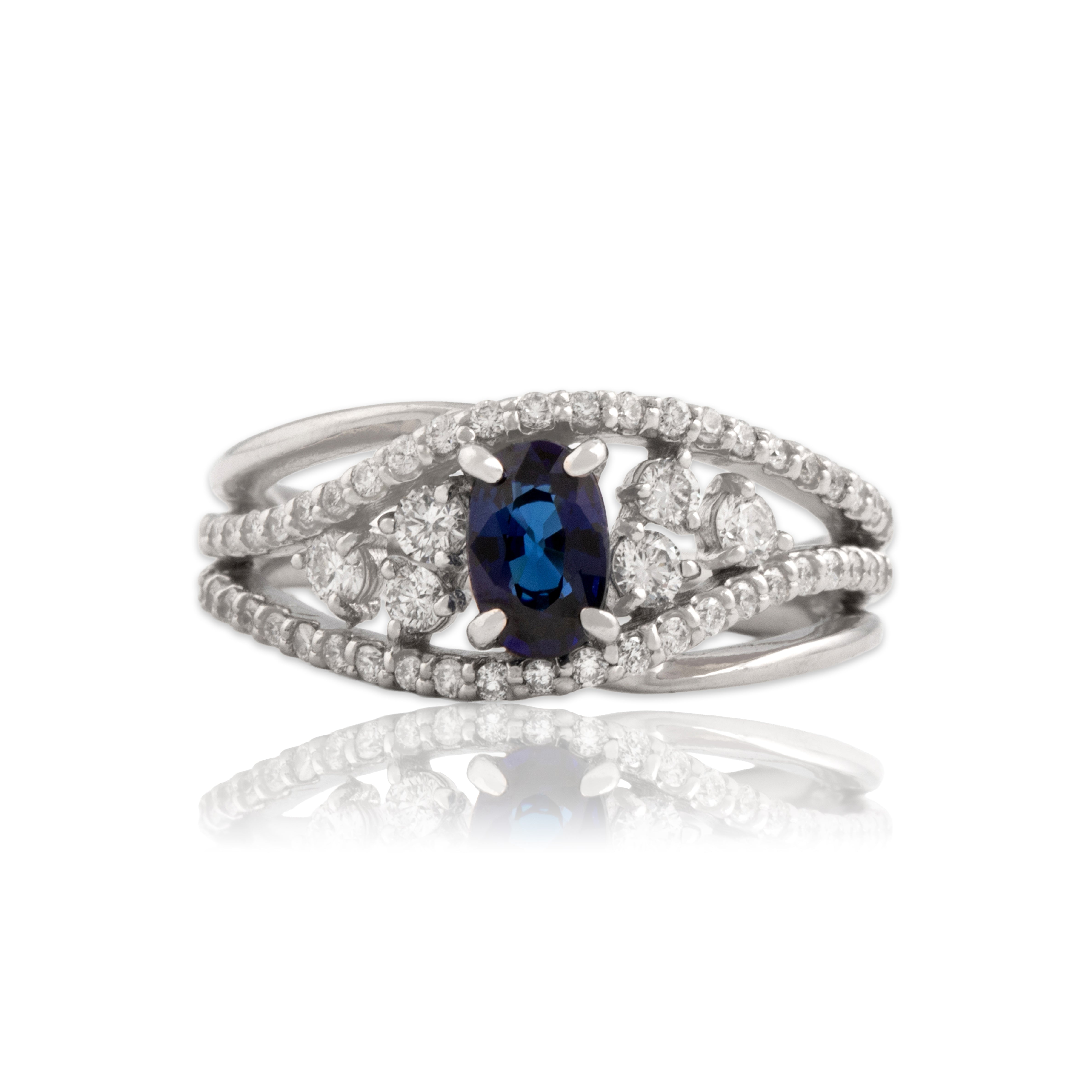 Vintage Platinum Blue Sapphire Diamond Swirling Dazzling Accented Ring - Close-up view