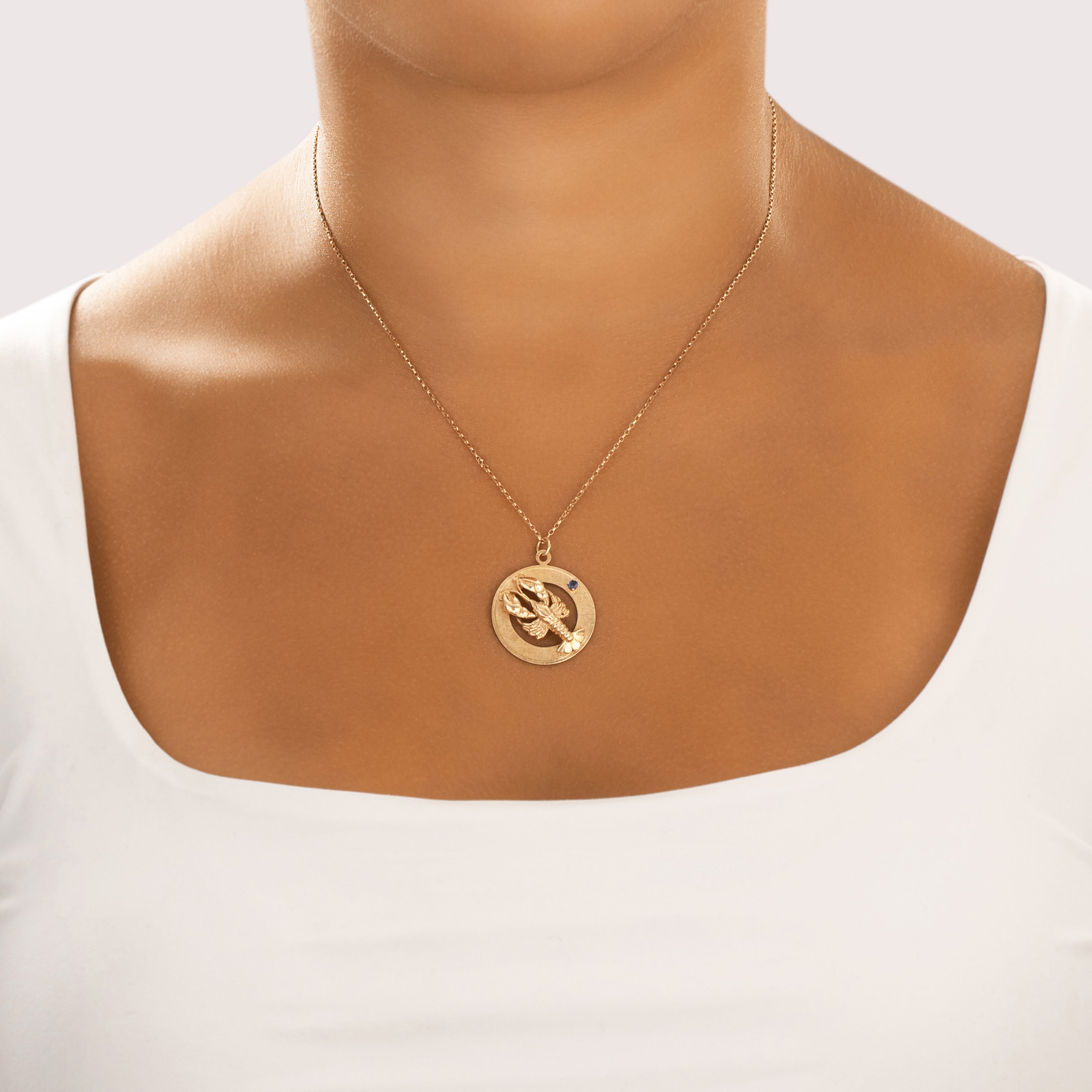 Vintage 14k Yellow Gold Blue Sapphire Etched Lobster Medallion Pendant - On model view