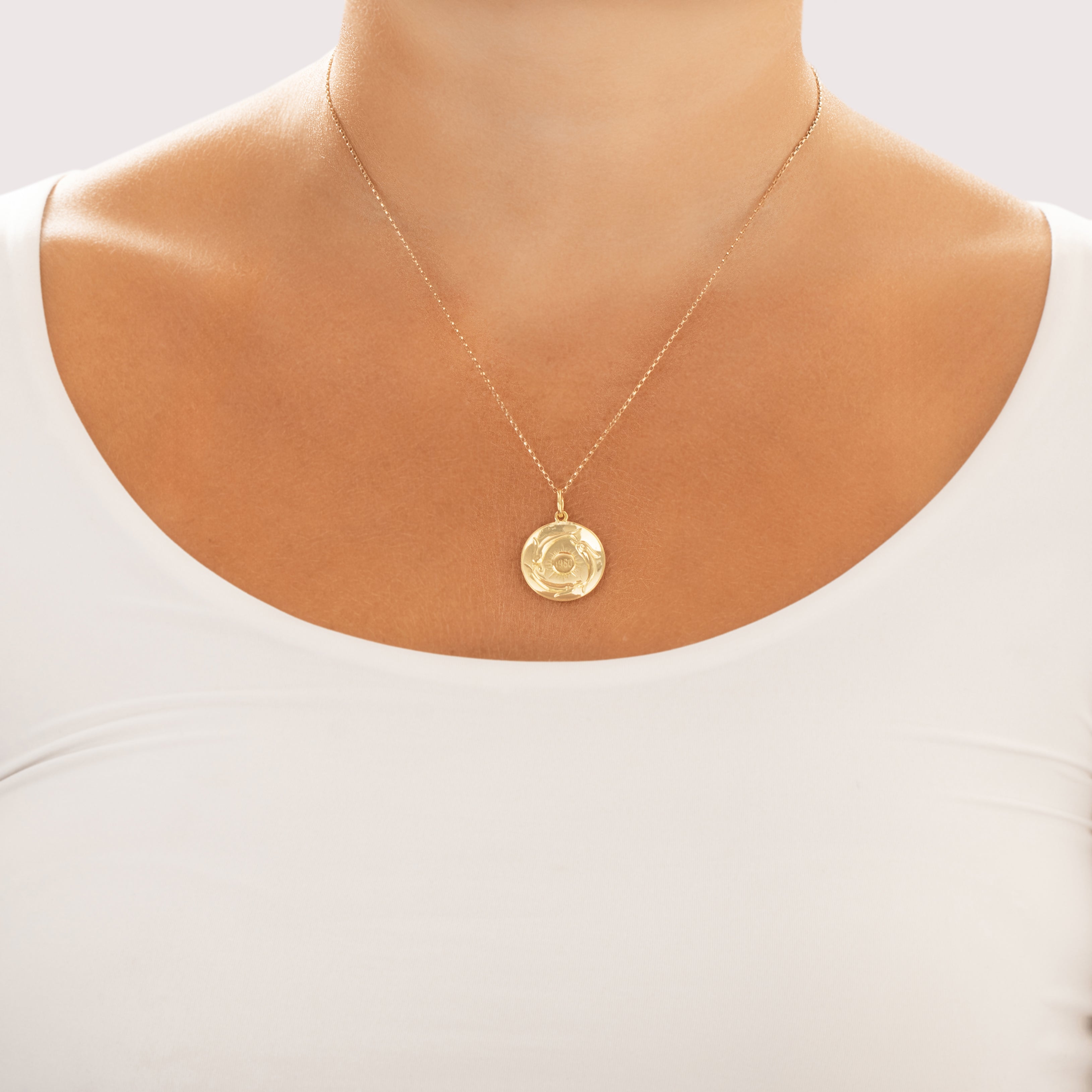 Vintage 18k Yellow Gold Gleaming Swimming Fish Sun Disc Charm / Pendant - On model view