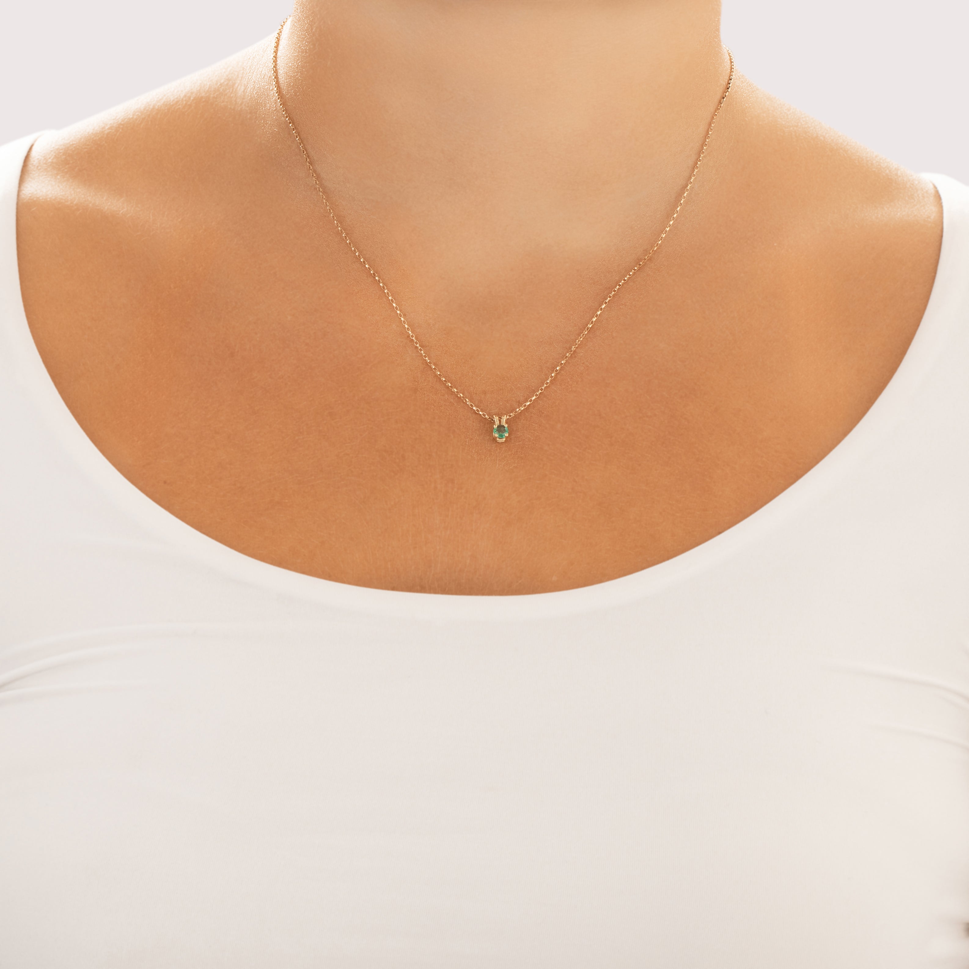Vintage Small 14k Yellow Gold Emerald Bright Solitaire Pendant - On model view