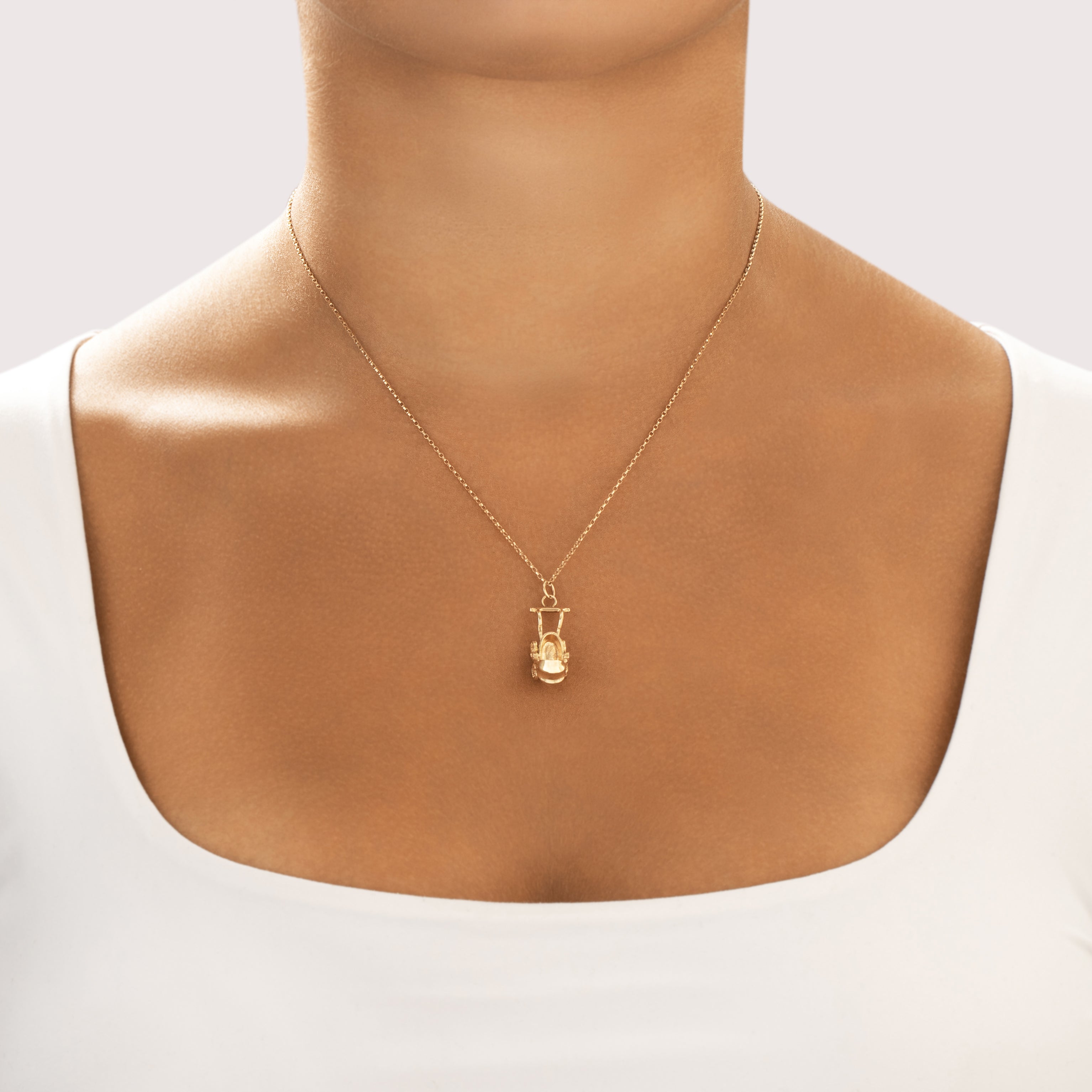 Vintage 14k Yellow Gold Adorable Articulating Baby Carriage Charm / Pendant - On model view