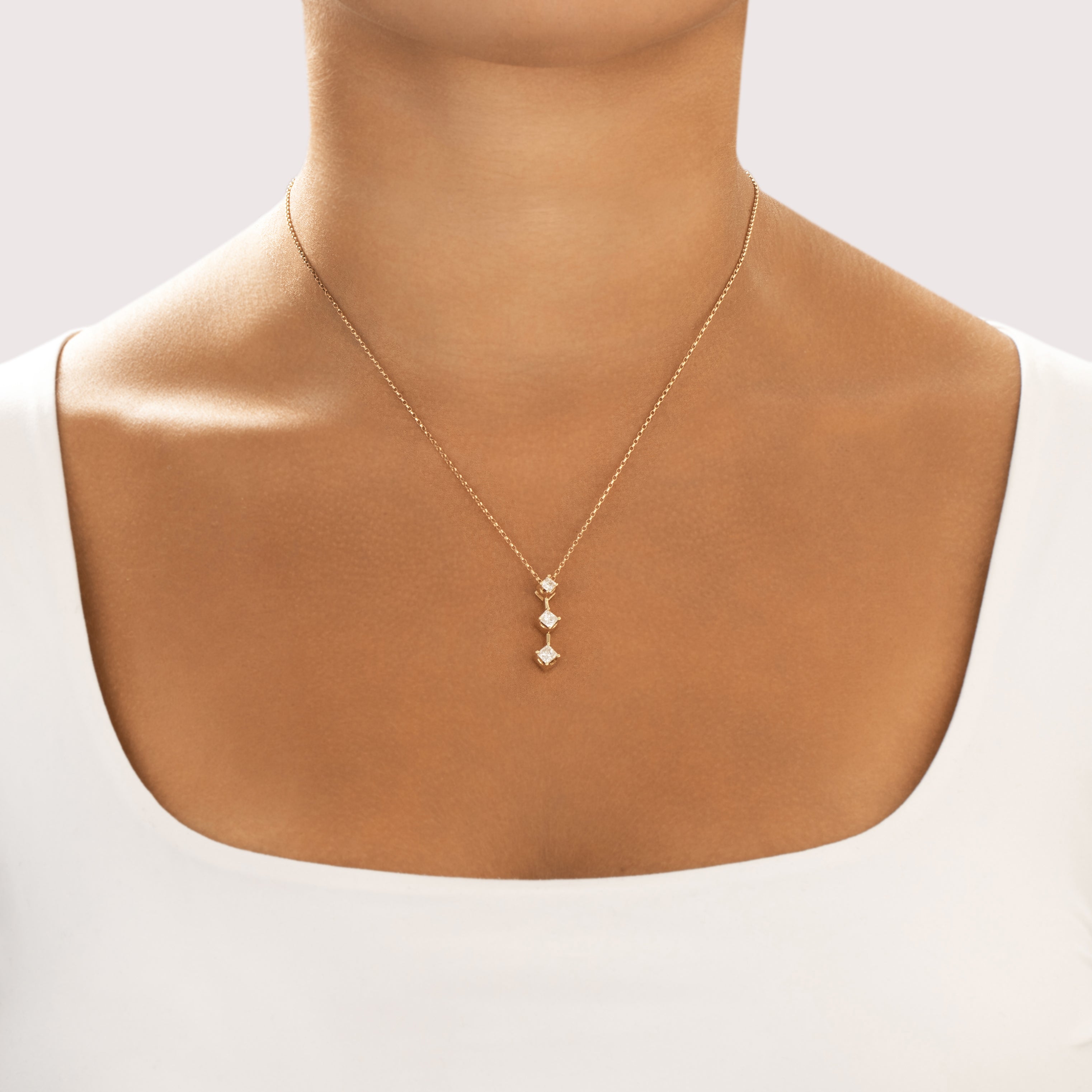 Vintage 14k Yellow Gold .57cttw Diamond Sparkling Princess-Cut Trio Drop Pendant - On model view