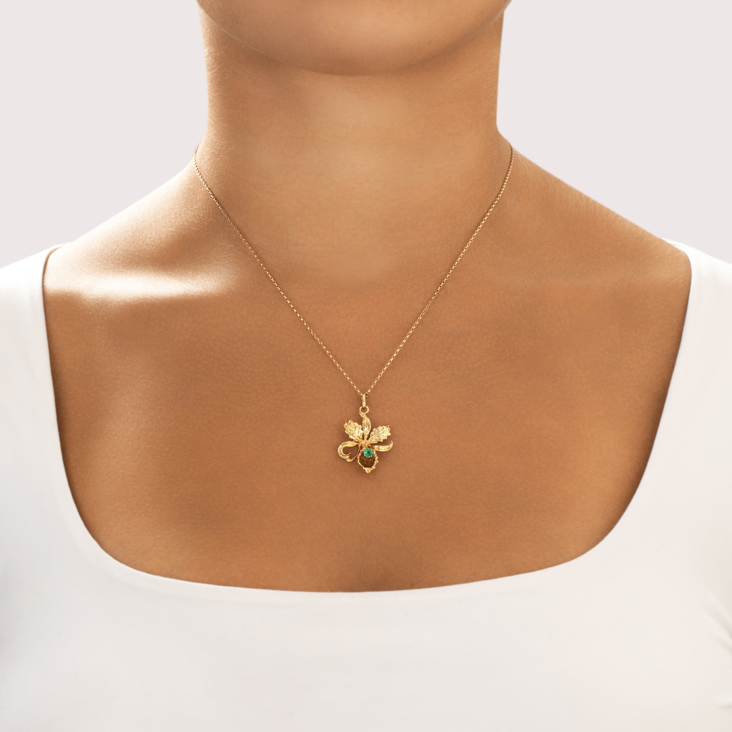 Vintage 18k Yellow Gold Emerald Heart Detail Blooming Iris Pendant - On model view