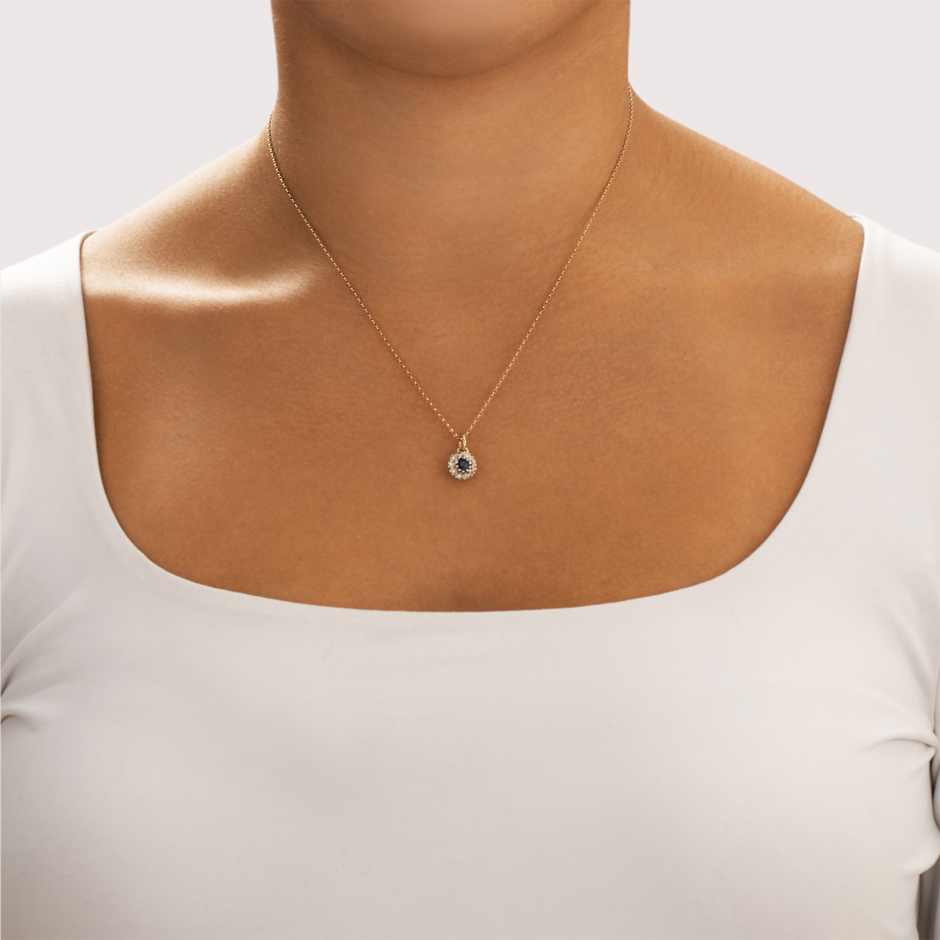 Vintage 10k Yellow & White Gold Blue Sapphire Diamond Dainty Halo Charm / Pendant - On model view