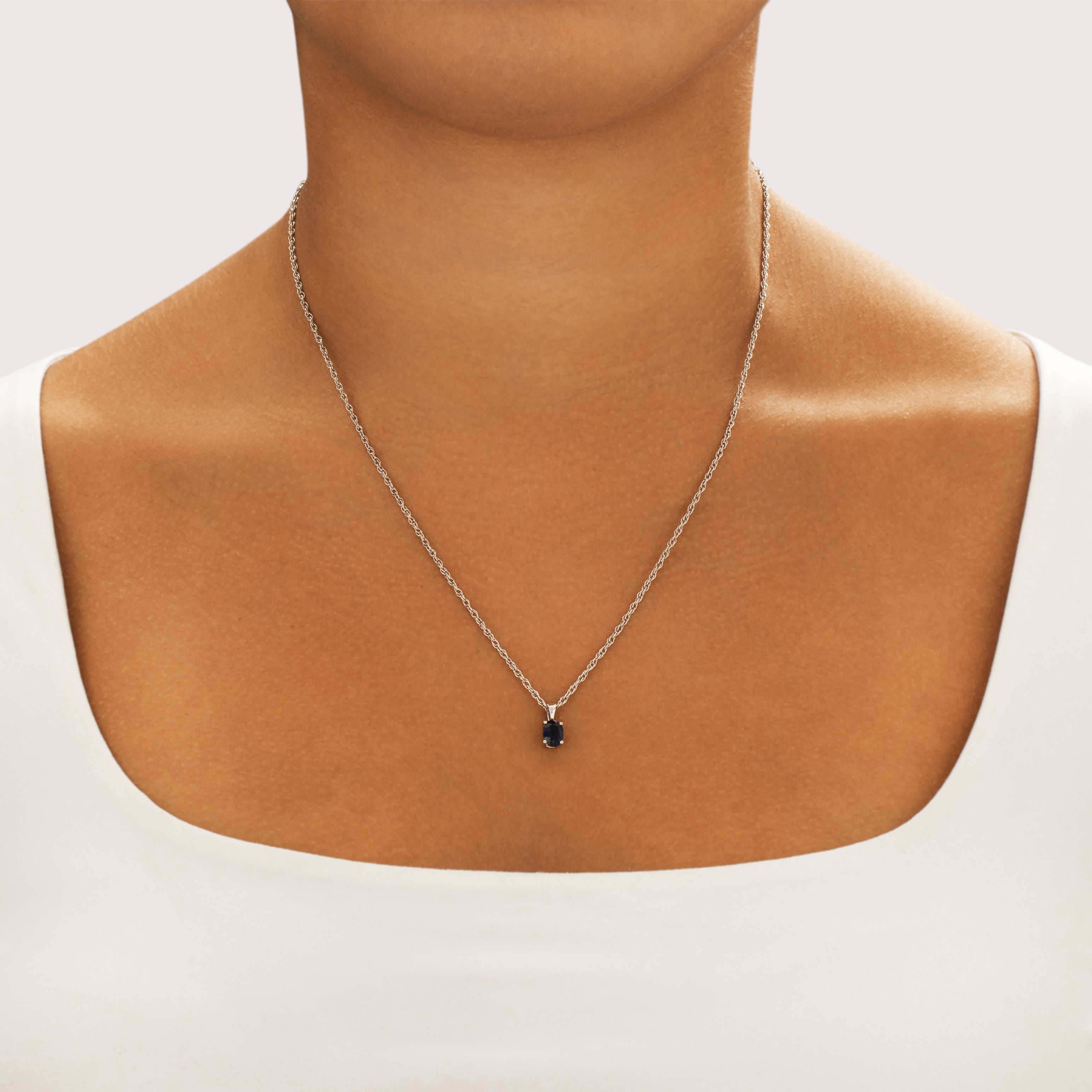 Vintage Small 18k White Gold .9ct Blue Sapphire Night Sky Oval Pendant - On model view
