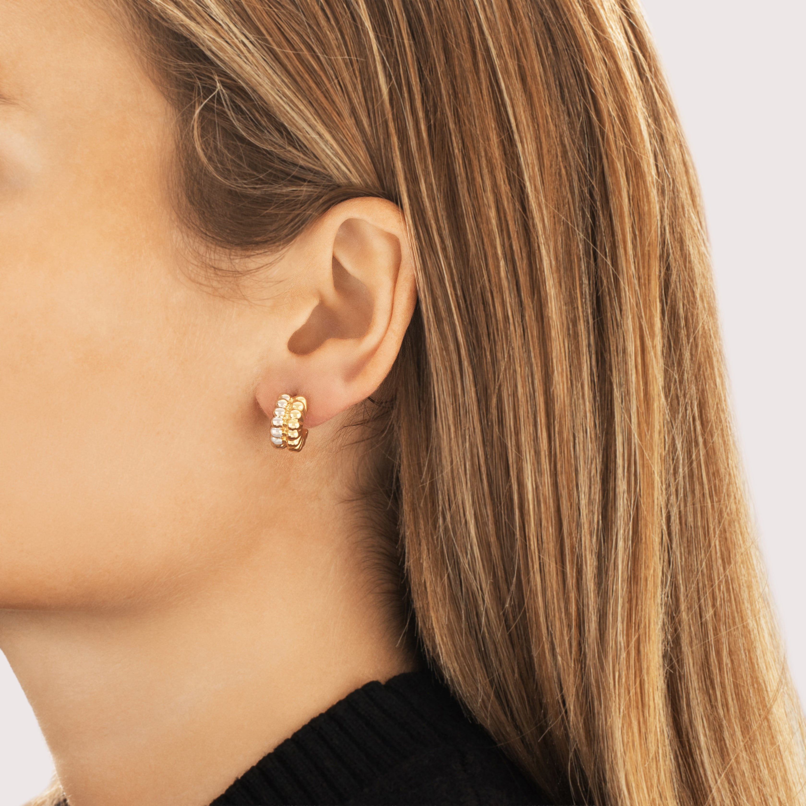 Vintage Small 18k Yellow & White Gold Puffy Two Tone Hoop Earrings - On model view