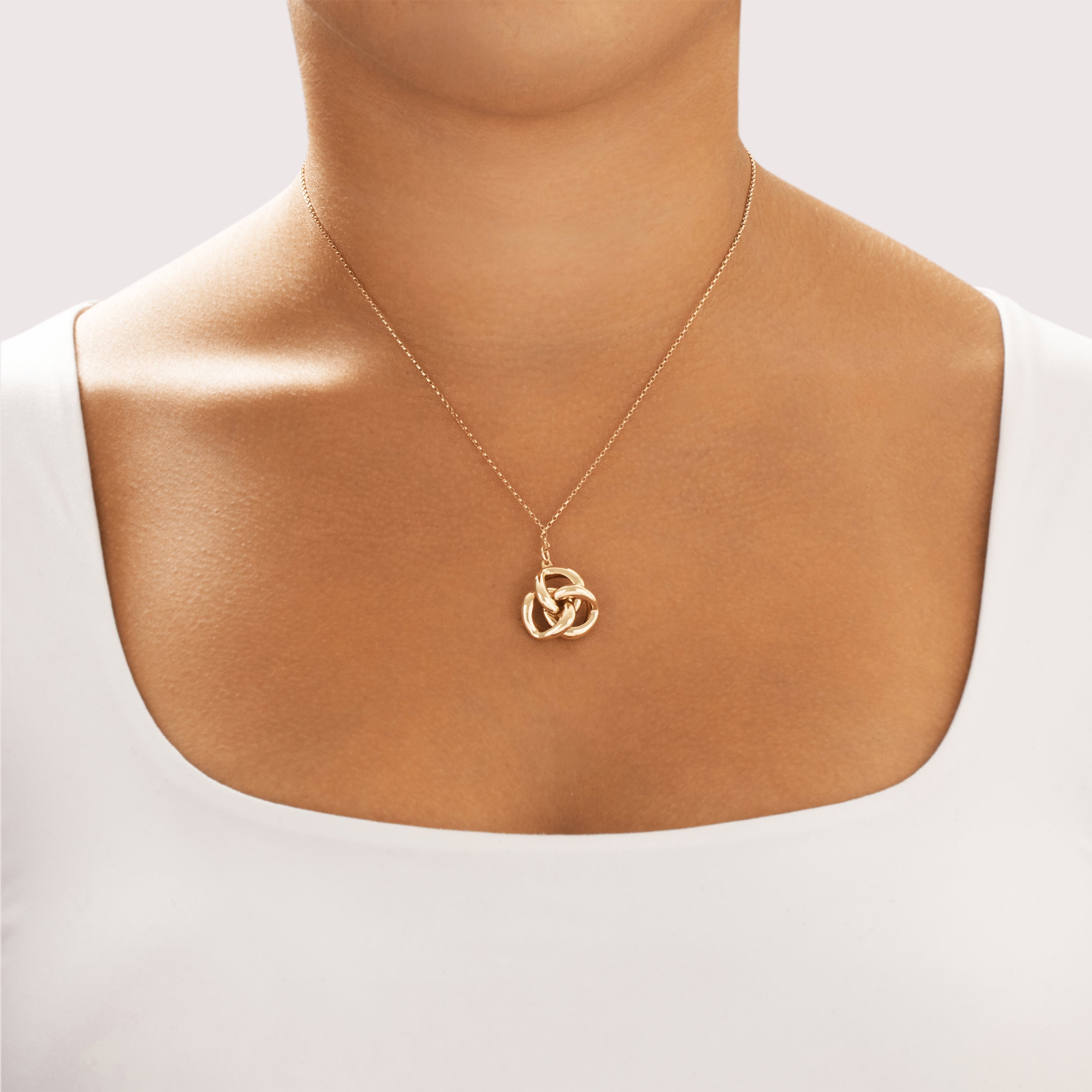 Vintage 14k Yellow Gold Puffed Love Knot Pendant - On model view