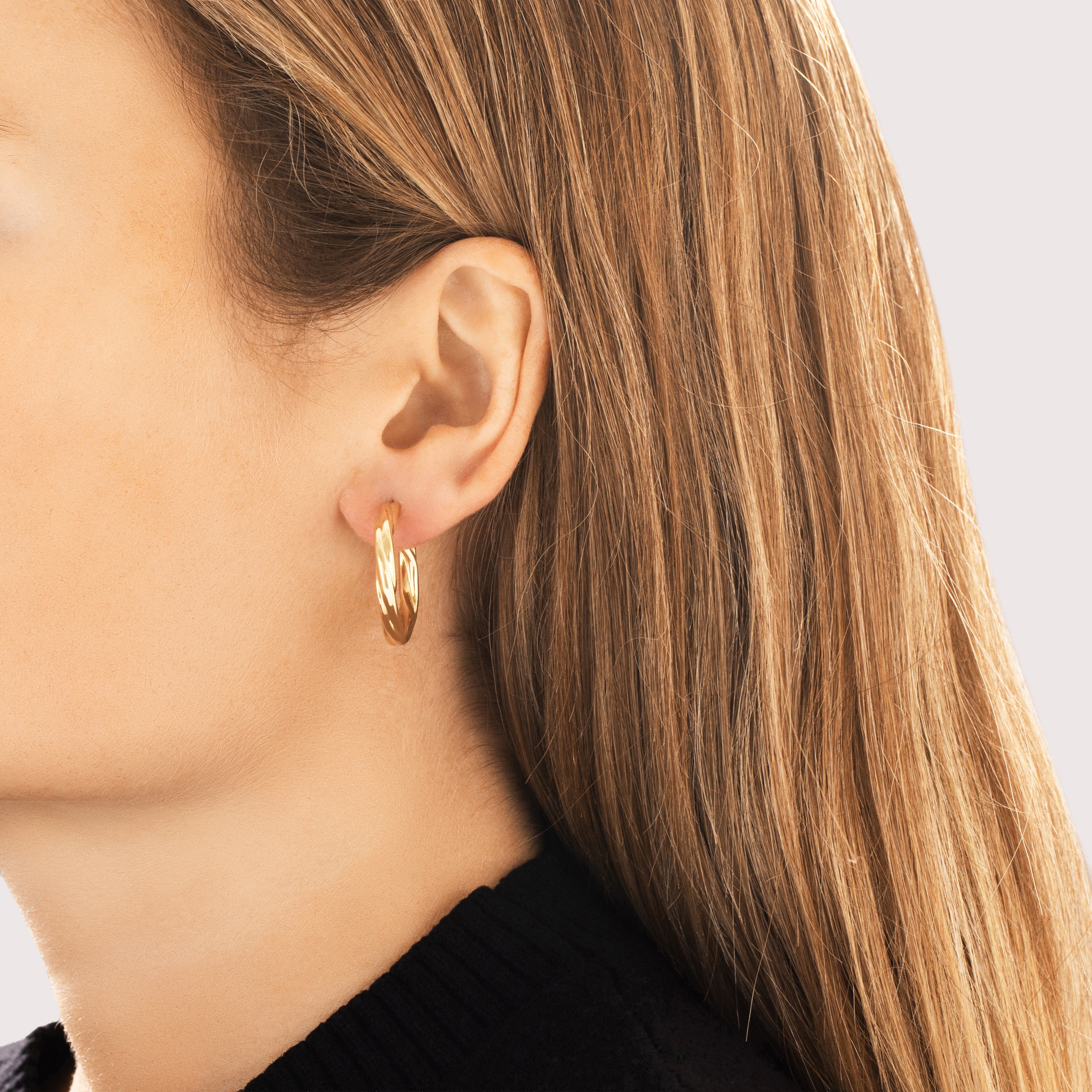 Vintage Italian 18k Yellow Gold Gleaming Twisted Tubular Hoop Earrings - On model view