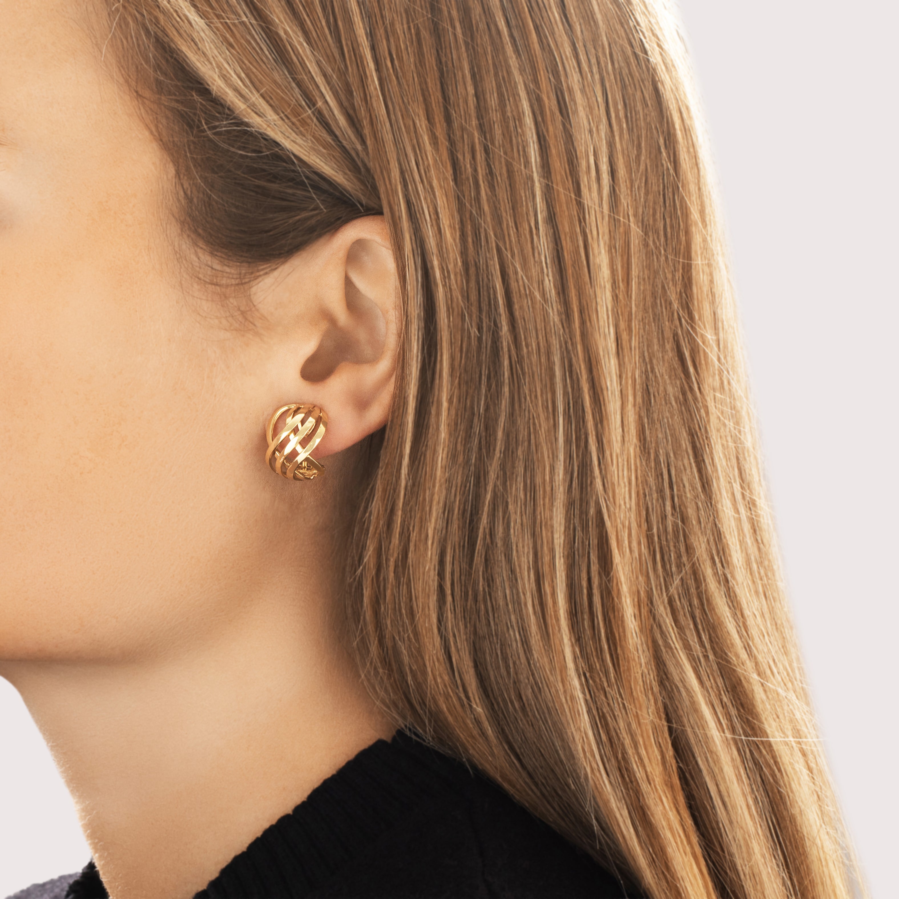 Vintage Italian 18k Yellow Gold Gleaming Interlocking Knot Omega-Back Earrings - On model view