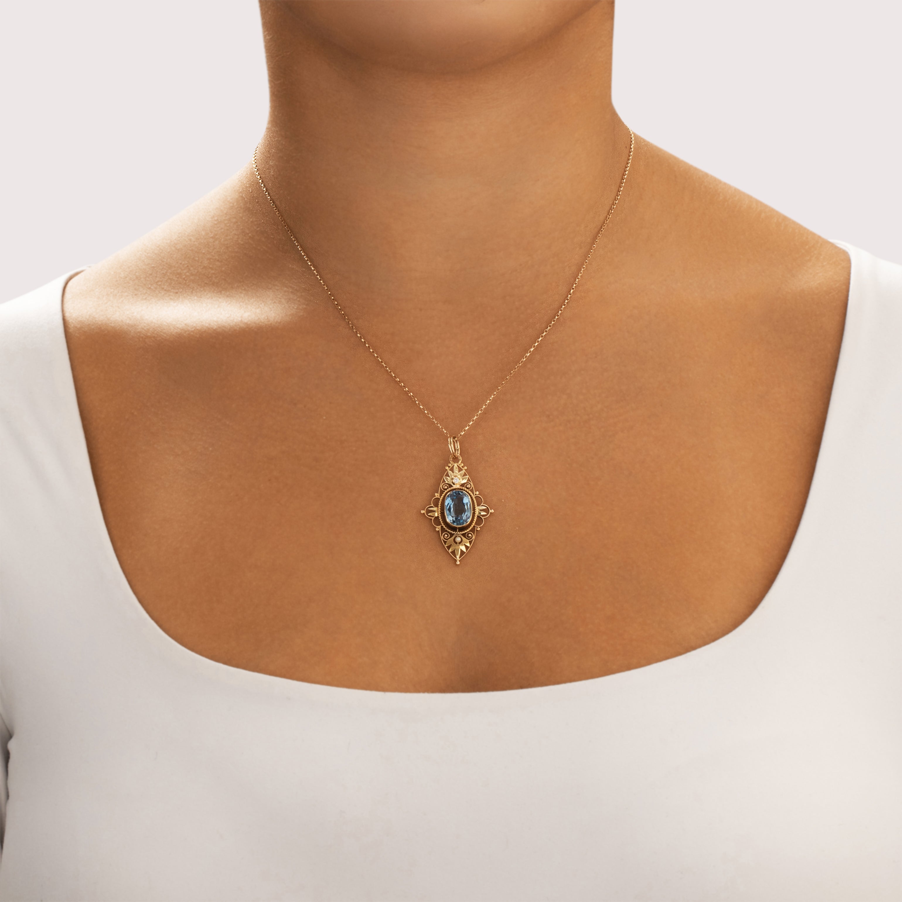 Vintage 14k Yellow Gold 3.76ct Light Blue Synthetic Spinel Natural Diamond Seed Pearl Open Filigree Pendant - On model view