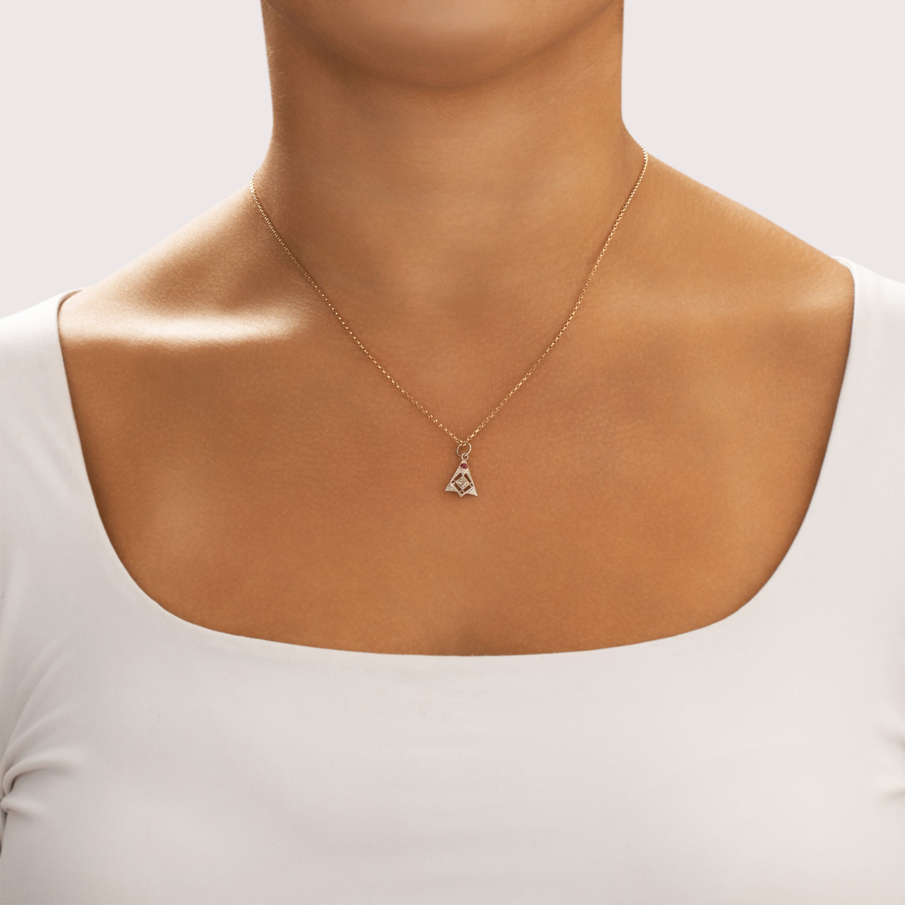 Antique Platinum & 14k Yellow Gold & 14k White Gold Synthetic Ruby Natural Old Mine Cut Diamond Dainty Geometric Dangle Charm / Pendant - On model view