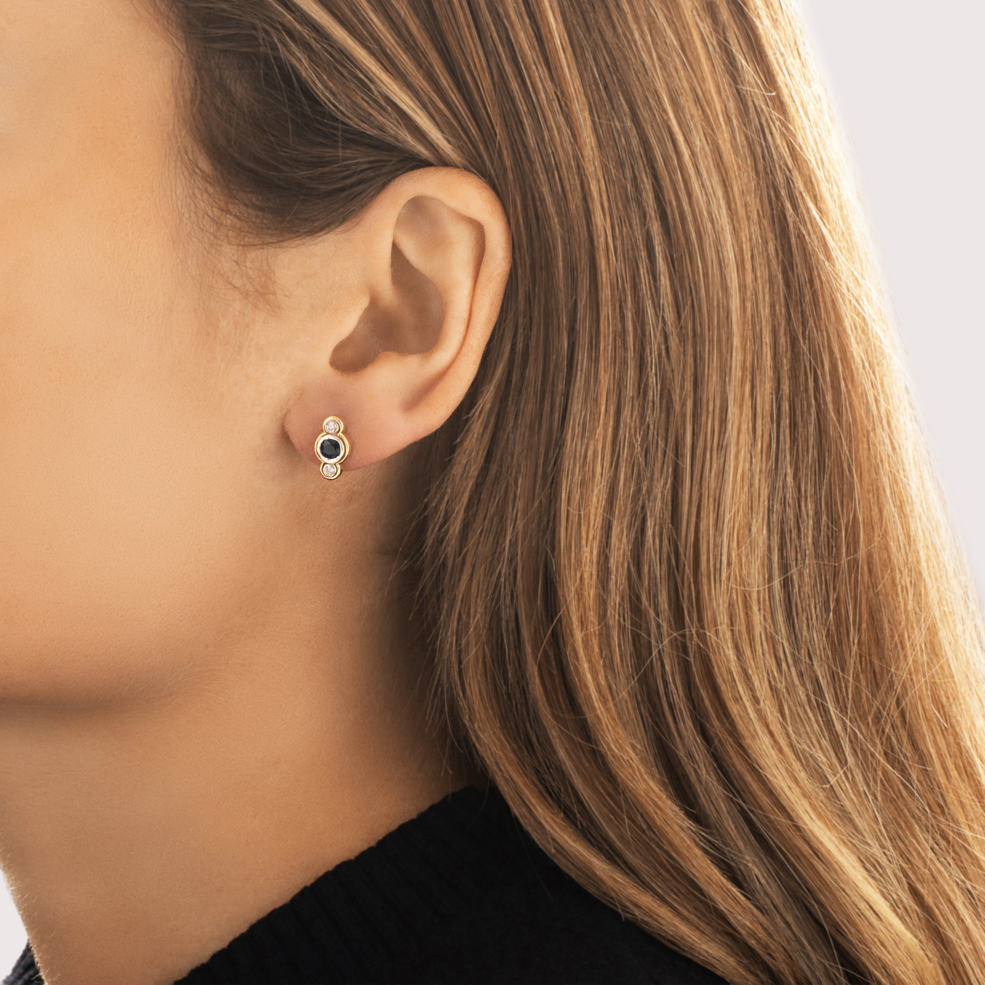Vintage 18k Yellow & White Gold .69cttw Sapphire Diamond Sleek Two-Toned Bezel Trio Stud Earrings - On model view