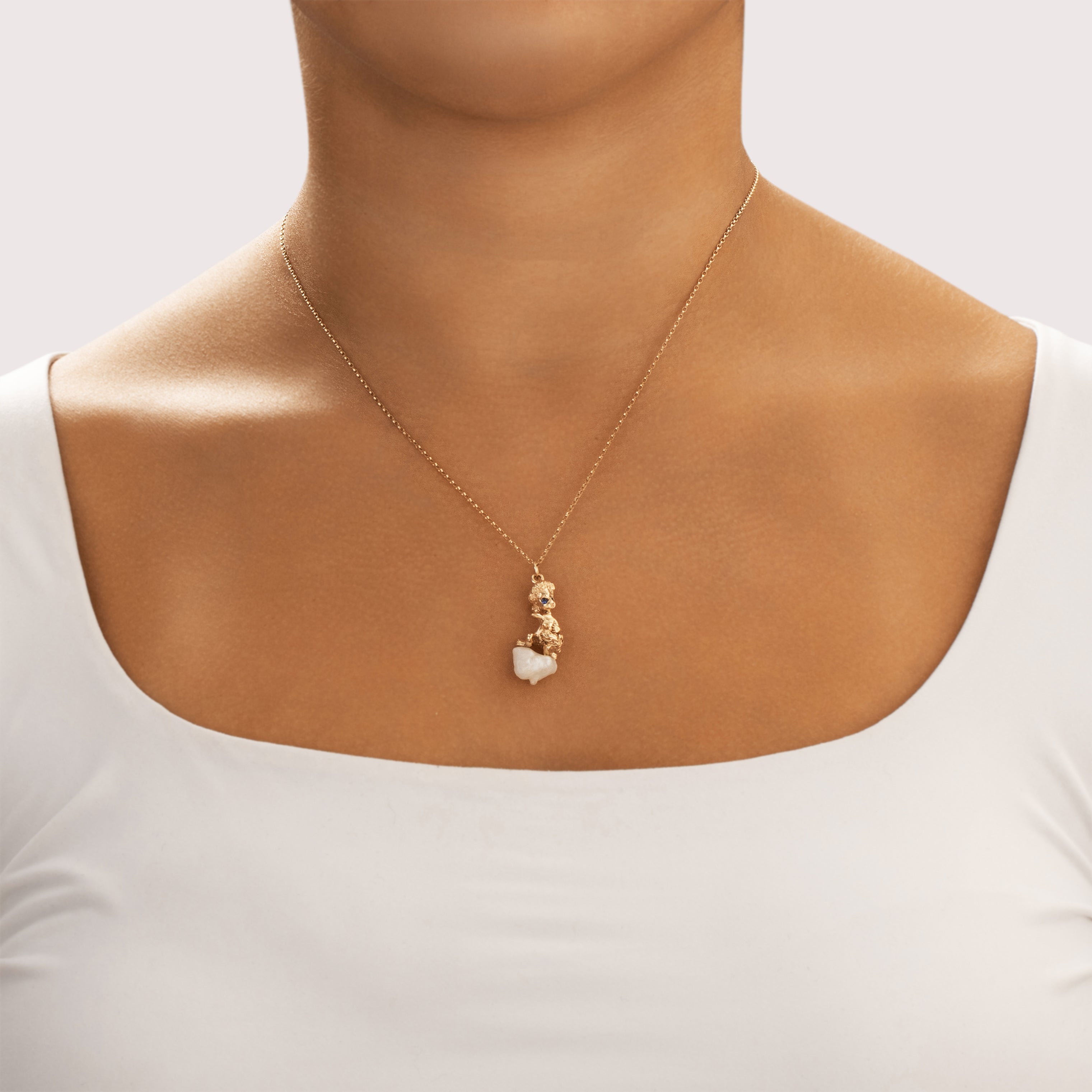 Vintage William Ruser Heavy 14k Yellow Gold Freshwater Baroque Pearl Blue Synthetic Sapphire Kneeling Cherub Charm / Pendant - On model view