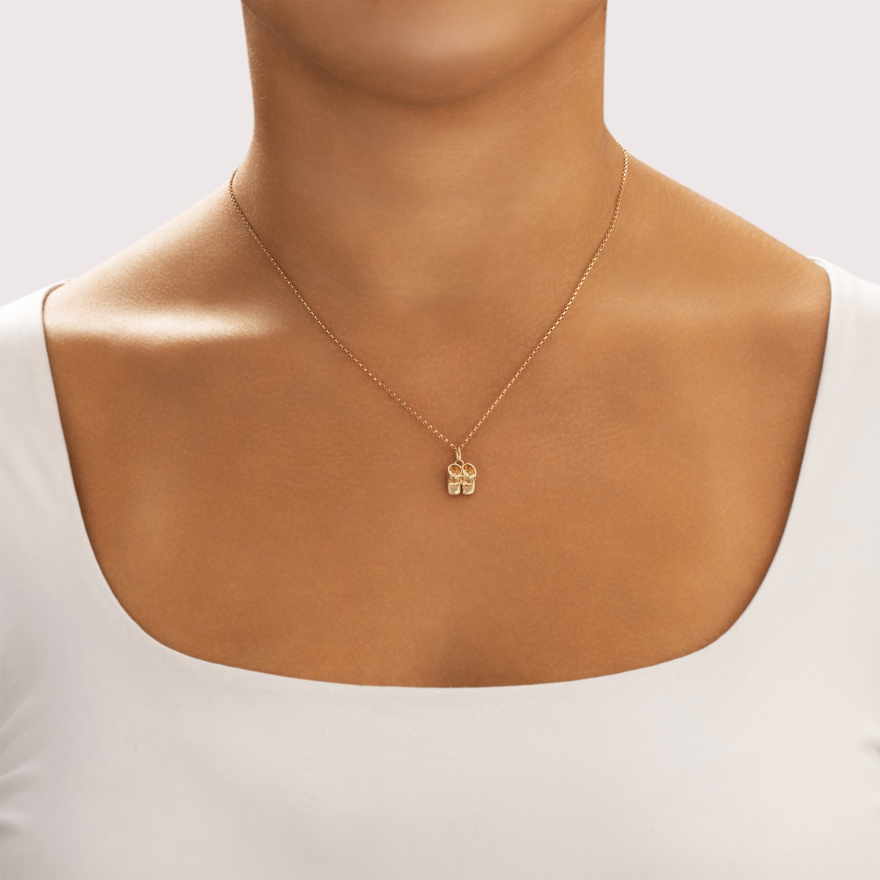 Vintage 10k Yellow Gold Petite Baby Shoes Charm / Pendant - On model view