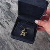 Vintage English 9k Yellow Gold Glass Cabochons Articulated Baby Carriage Charm - Video showing the piece
